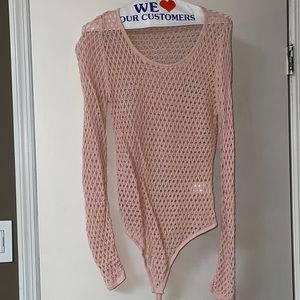 Pink fishnet bodysuit